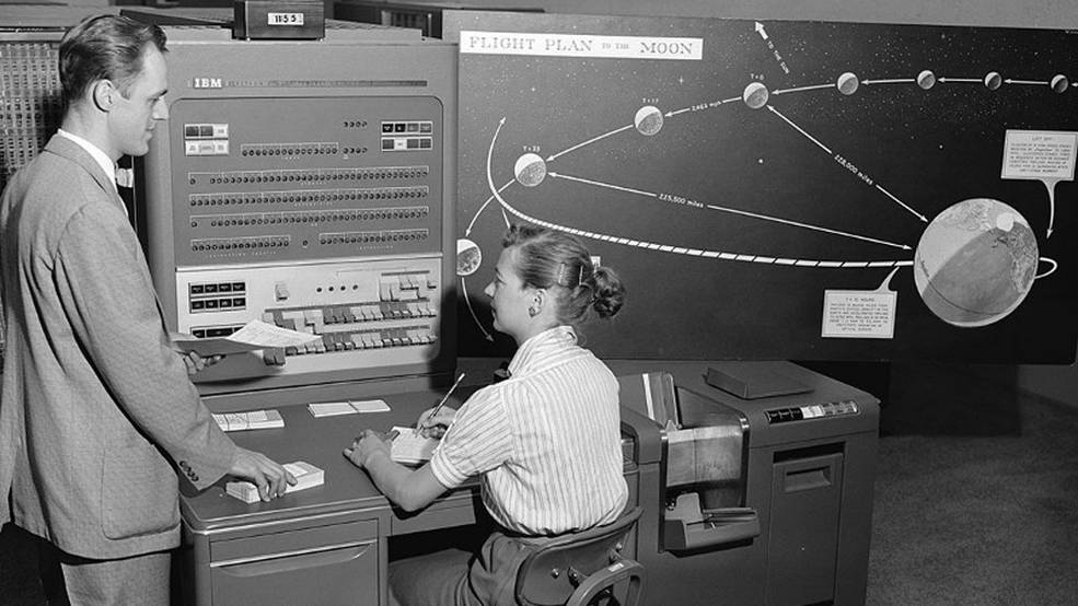 Human_computer_with_IBM_704_in_1959